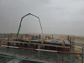 A concrete pour in progress at Lavita, The Oasis, with a boom pump over a reinforced deck