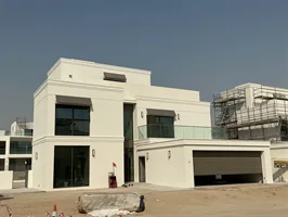 A rendered and painted villa at Palmiera 2, The Oasis, with glazing and balcony balustrade fitted